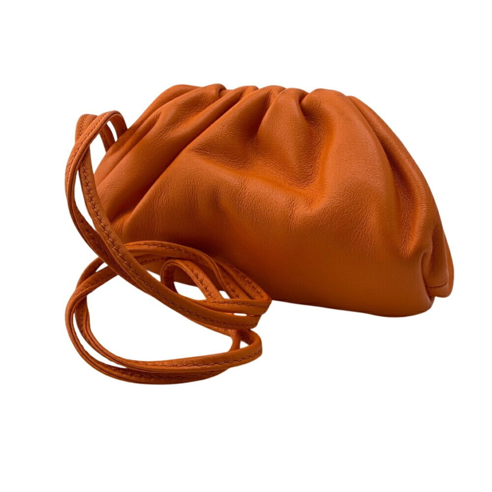 Bottega Veneta Coin Purse/ Coin Case Leather: Bottega Veneta Coin Purse/ Coin Case Leather The Bottega Veneta Coin Purse features a vibrant orange leather exterior with subtle scratches and signs of usage. Made from high-quality leather, this