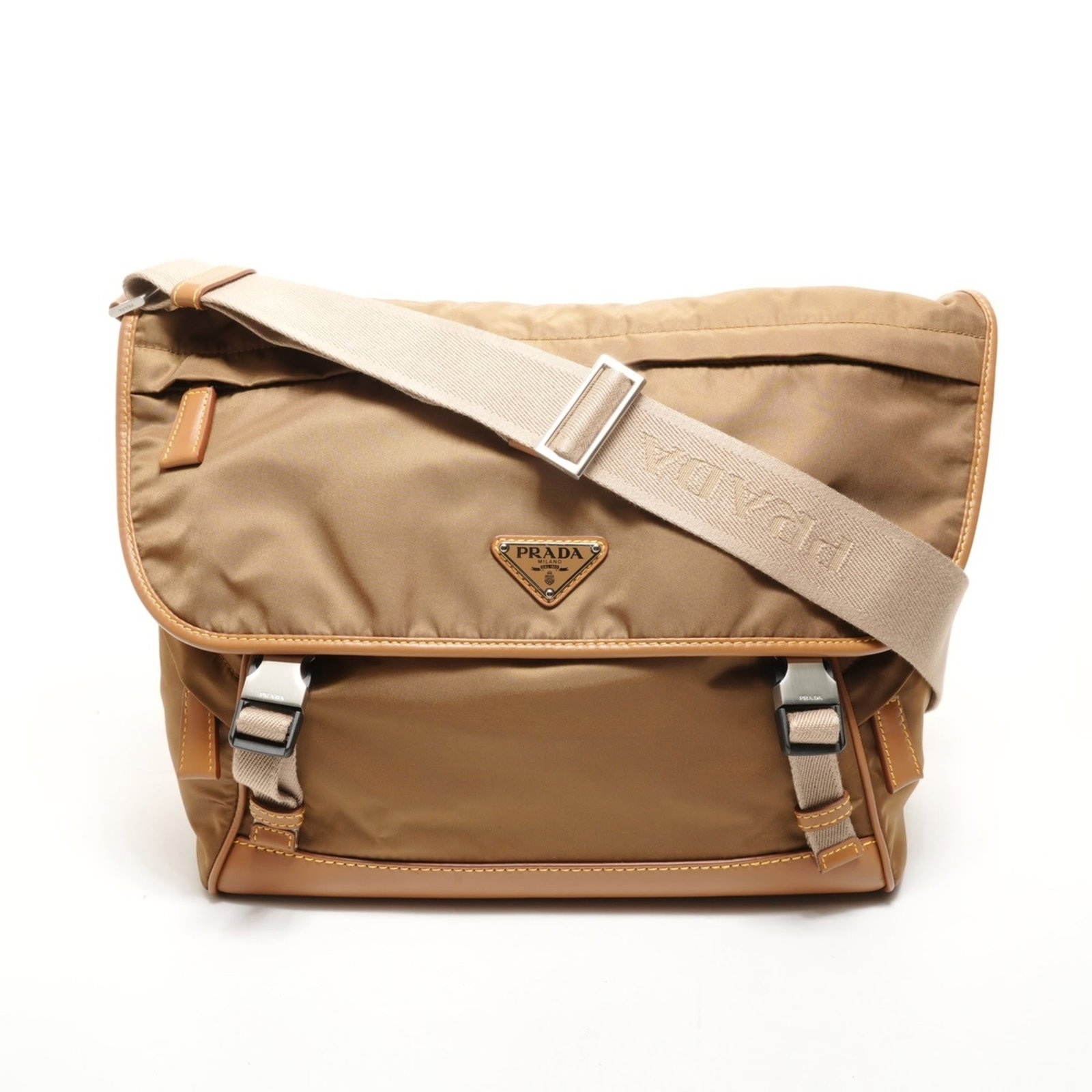 Shoulder Bag Nylon by Prada: Shoulder Bag Nylon by Prada Prada's Nylon shoulder bag boasts a timeless design with its classic beige color and durable nylon material. Measuring 26cm x 40cm x 17cm, it provides ample space for