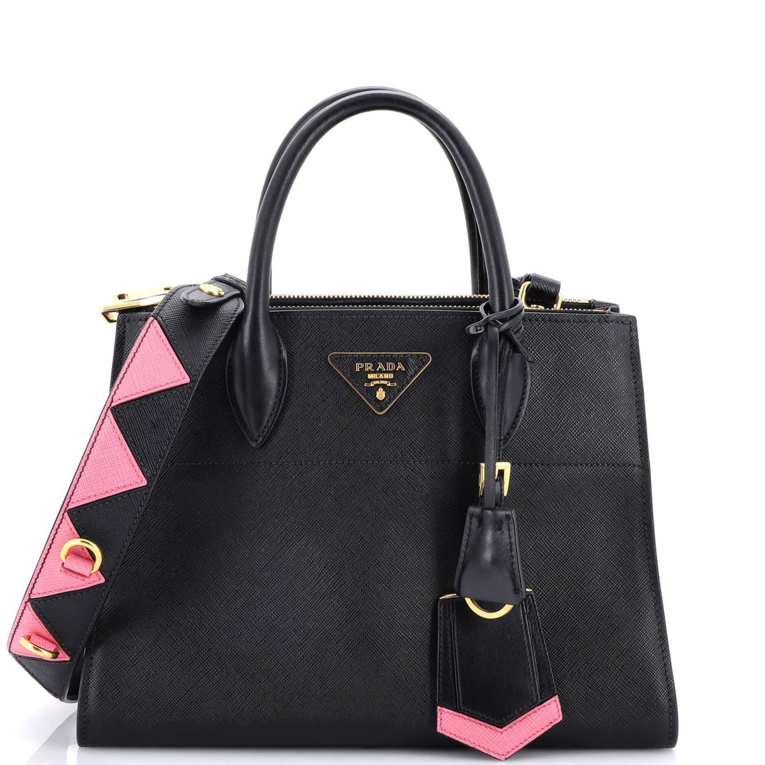 Saffiano leather medium tote by Prada Paradigme: Saffiano leather medium tote by Prada Paradigme Saffiano leather medium tote by Prada Paradigme, featuring classic black exterior with gold hardware and spacious interior. This stylish bag boasts a