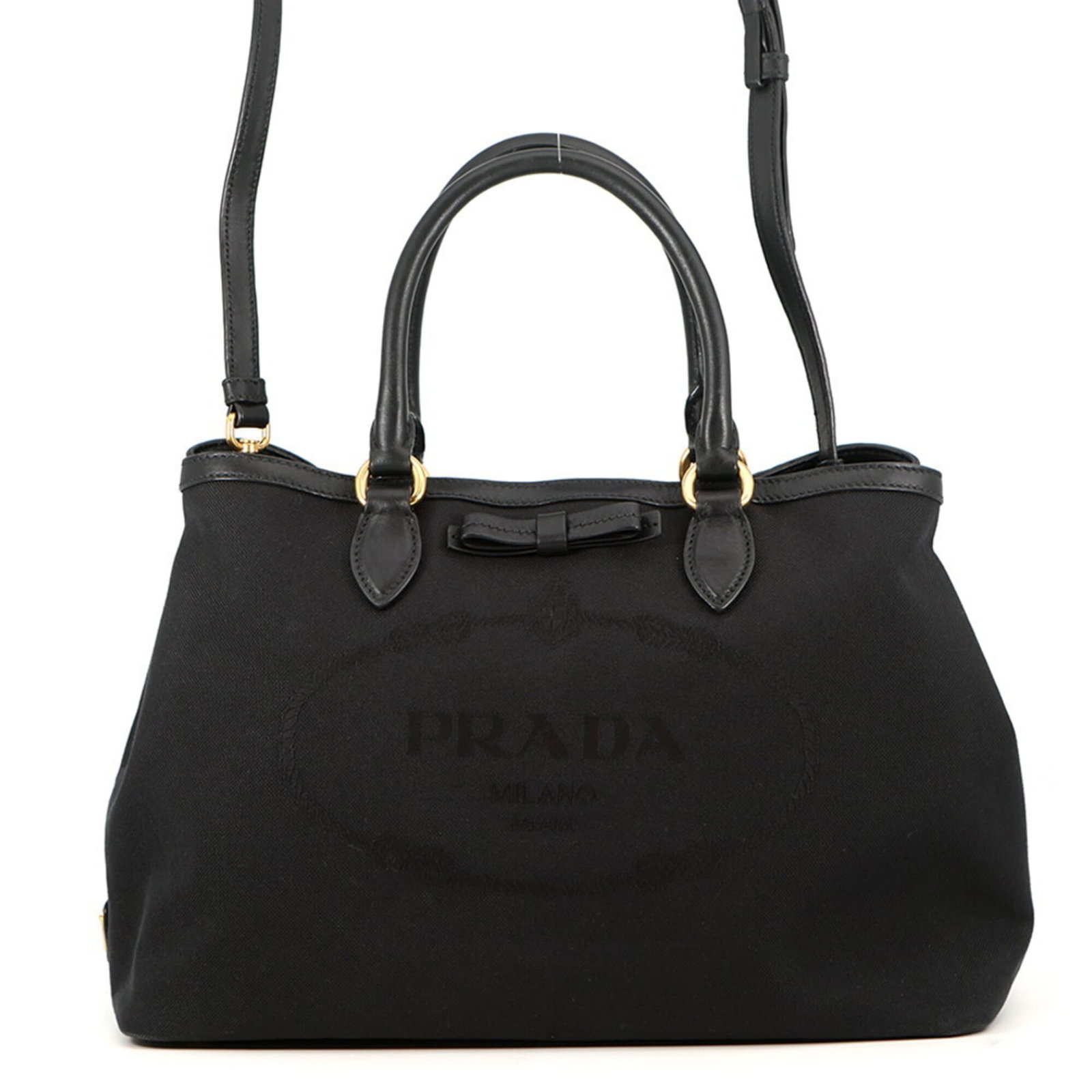 Canvas leather handbag: Canvas leather handbag Canvas leather handbag in black, featuring a durable canvas and high-quality leather construction. This stylish bag measures 22cm x 33.5cm x 16cm and boasts a classic design tha