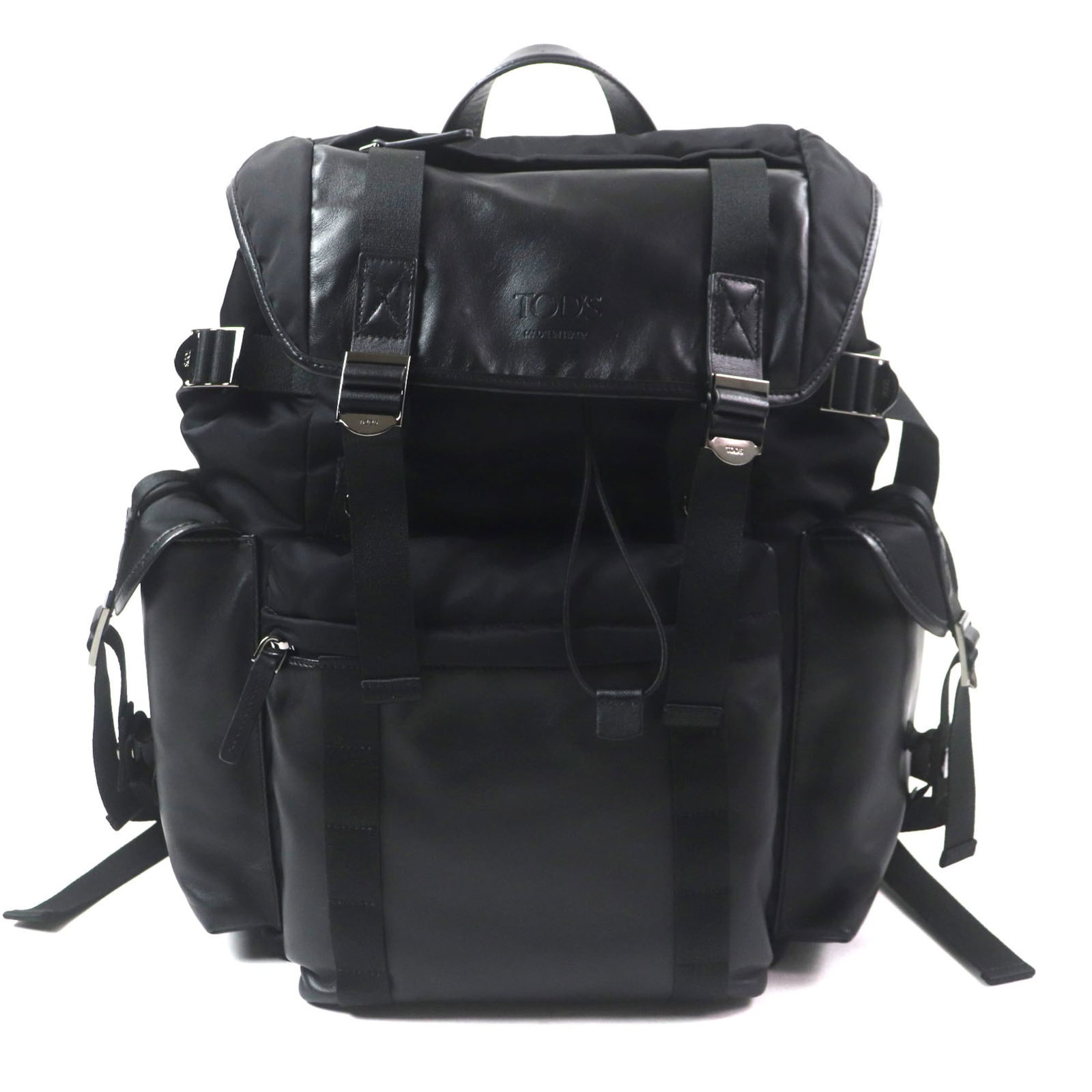 Leather Fabric Tod's Backpack: Leather Fabric Tod's Backpack This Tod's Leather Fabric Backpack is crafted from high-quality leather and fabric, with a sleek black design. Measuring 41cm x 34cm x 12cm, it offers a compact and