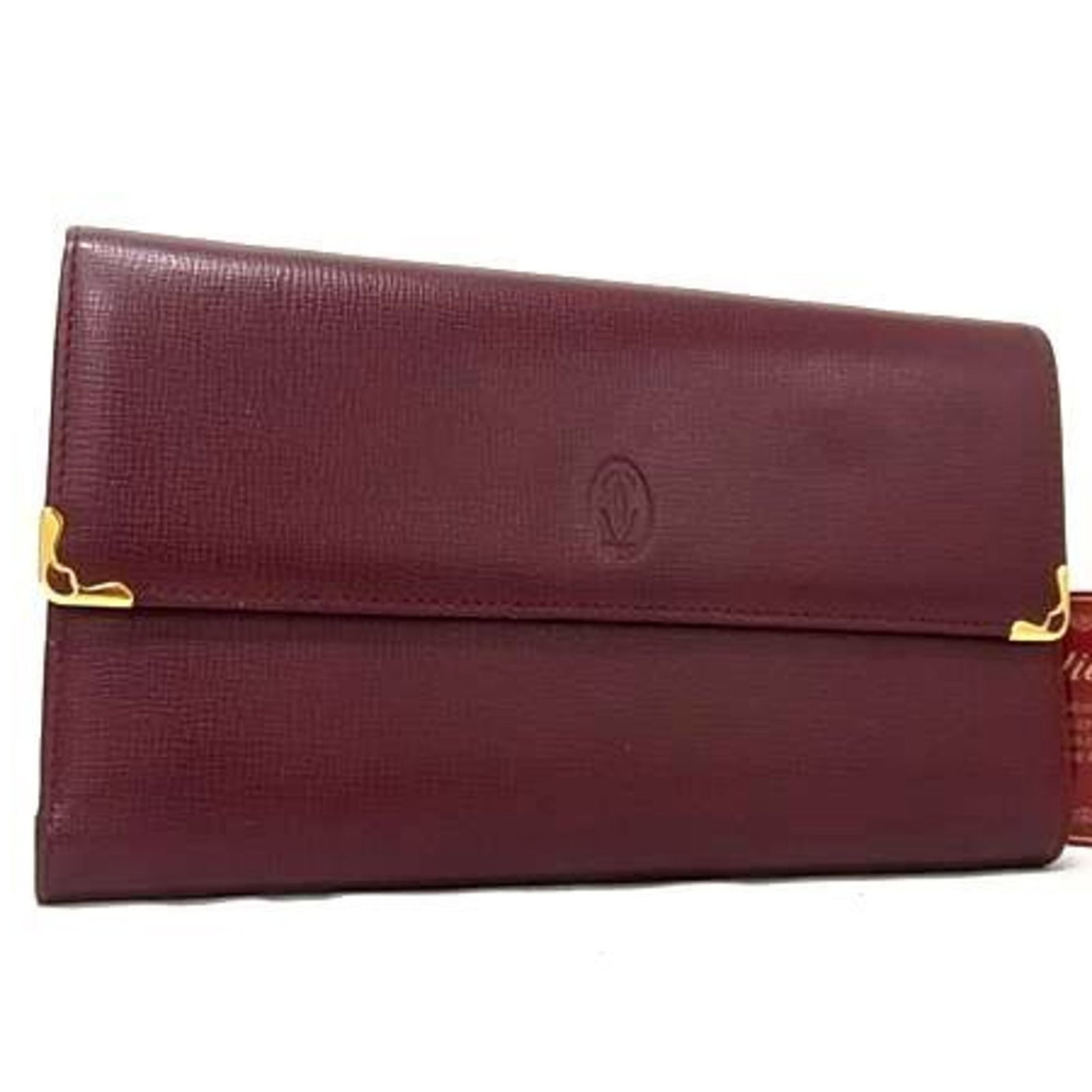 Cartier Wallet (Tri-Fold) Leather: Cartier Wallet (Tri-Fold) Leather Bordeaux leather Cartier tri-fold wallet, featuring classic design and timeless elegance. With its rich, dark color and durable construction, this wallet has been
