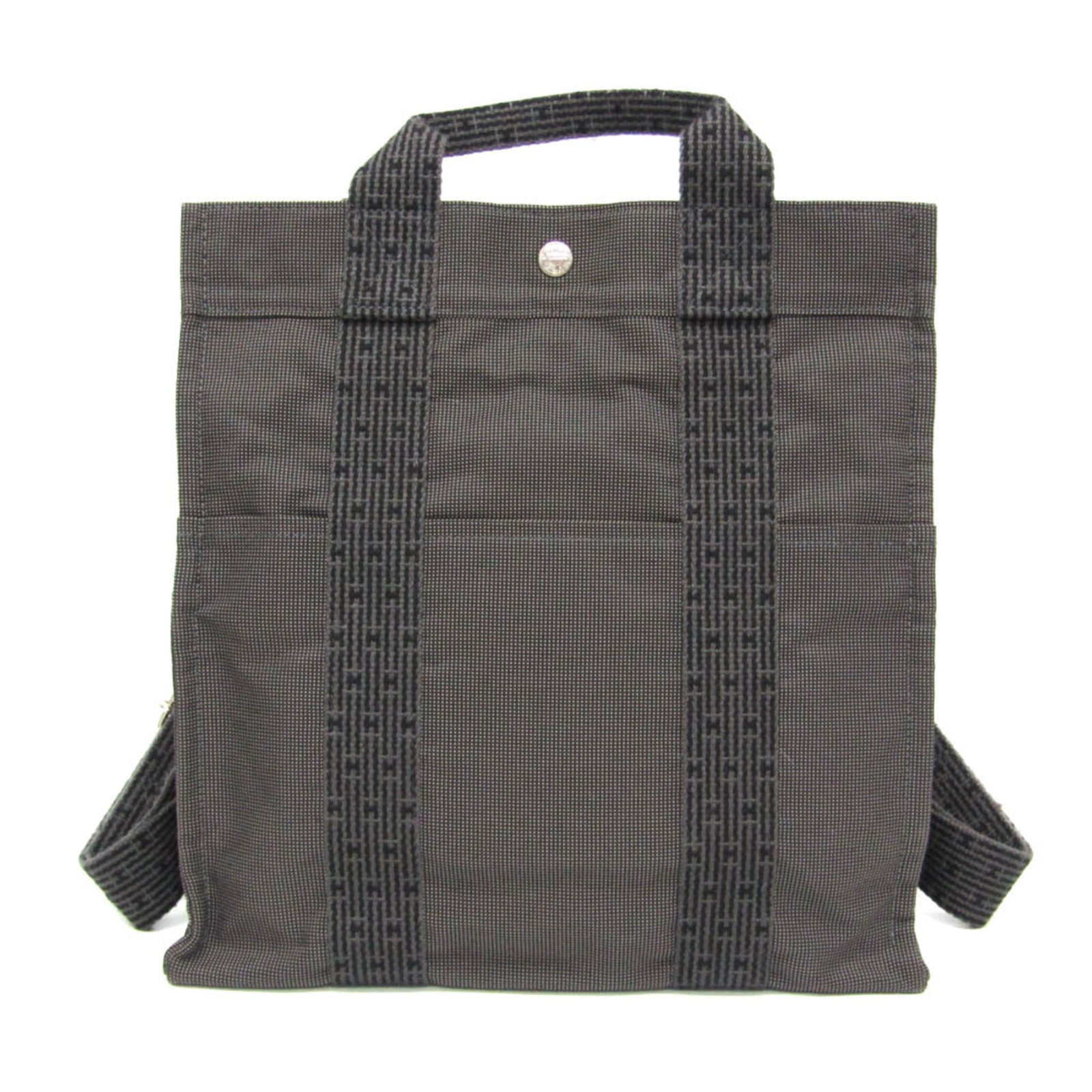 Hermes Backpack Polyester Polyamide: Hermes Backpack Polyester Polyamide The Hermes Backpack Polyester Polyamide features a sleek black and gray design with silver hardware, making it a stylish accessory for daily use. With its
