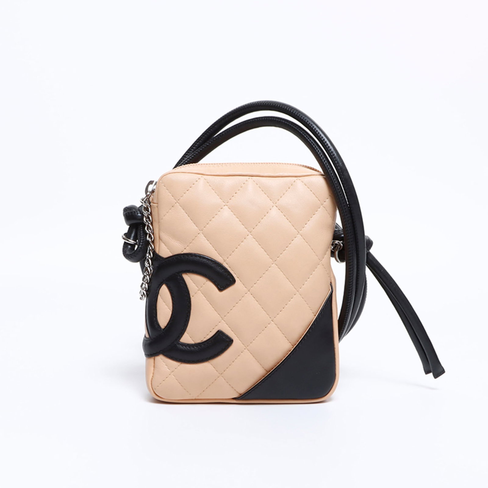 Shoulder Bag by Chanel: Shoulder Bag by Chanel Beige Chanel shoulder bag with a classic design, measuring 15cm x 13cm x 3cm. The bag has some minor scratches and dirt but remains in very good condition, showcasing the subtle