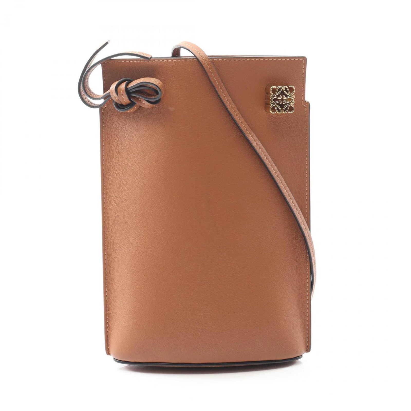 Shoulder Bag Leather by Loewe: Shoulder Bag Leather by Loewe This classic shoulder bag from Loewe features rich, supple leather in a timeless brown hue. With its clean lines and understated design, it's a versatile accessory that