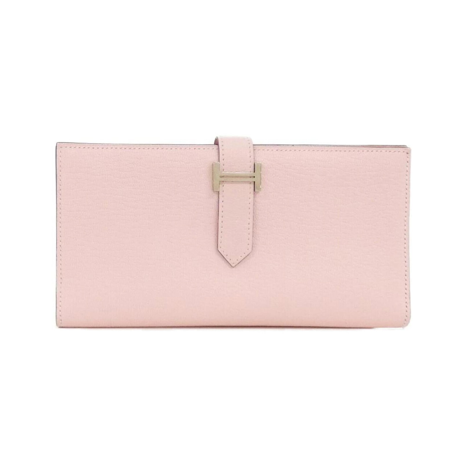 Chevre leather bi-fold wallet from Hermes: Chevre leather bi-fold wallet from Hermes Chevre leather bi-fold wallet from Hermes features a unique pink hue and a classic design. Made from high-quality chevre leather, this wallet measures 9cm x 1