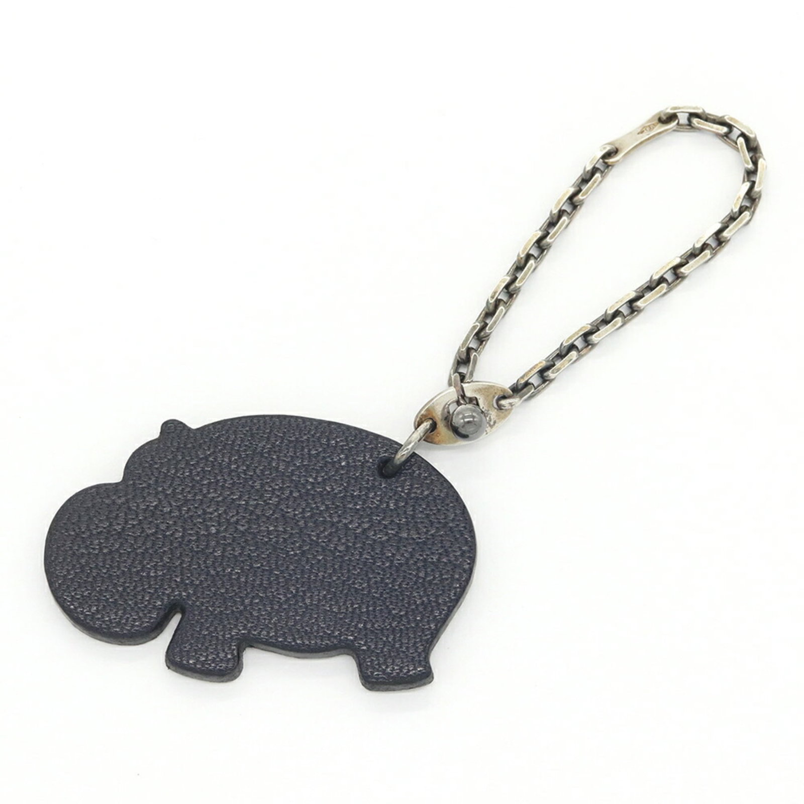 Chevre leather key chain by Hermes: Chevre leather key chain by Hermes Chevre leather key chain by Hermes, featuring a unique green and navy color combination. Made from high-quality chevre leather, this small but stylish accessory meas
