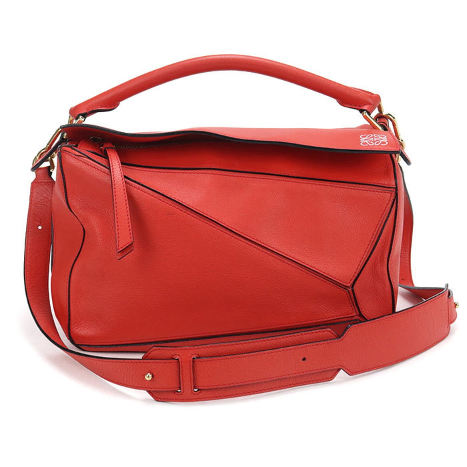 Handbag Leather from Loewe: Handbag Leather from Loewe This stunning Loewe handbag features rich, vibrant red leather and elegant gold hardware. Made from high-quality calfskin, it boasts a classic design with a timeless appeal.