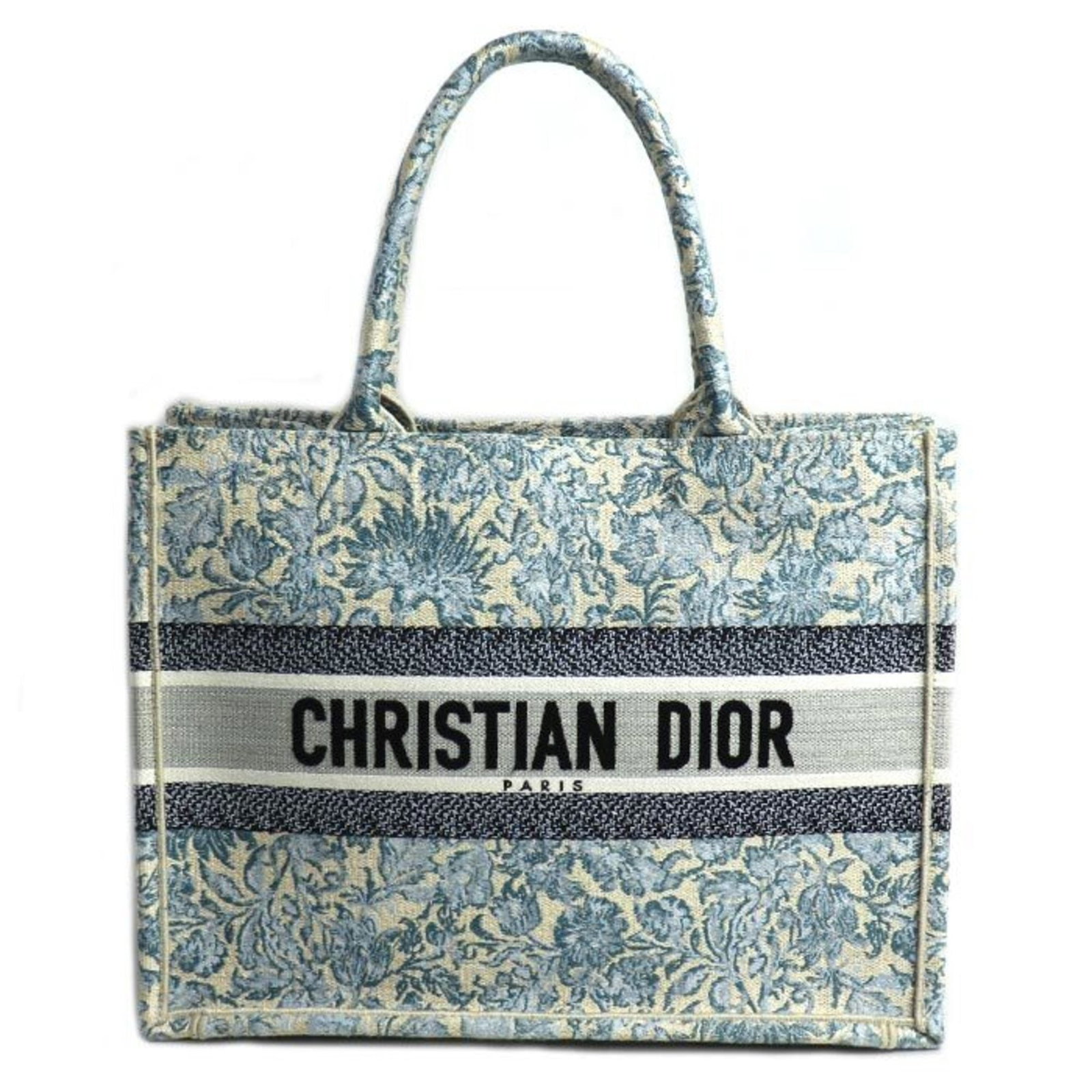 Canvas tote bag by Christian Dior: Canvas tote bag by Christian Dior Canvas tote bag by Christian Dior, featuring a striking blue and multi-color design. This used canvas tote bag has visible traces of usage, scratches, and dirt, but