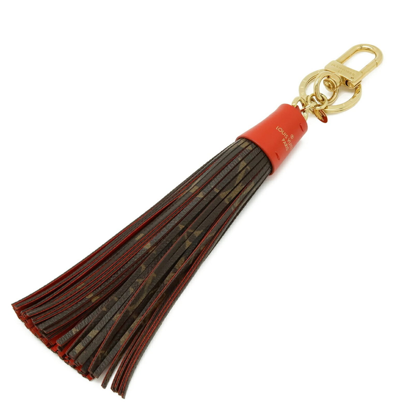 Louis Vuitton Monogram Tassel Rouge Charm Bag Keychain Accessory: Louis Vuitton Monogram Tassel Rouge Charm Bag Keychain Accessory The Louis Vuitton Monogram Tassel Rouge Charm Bag Keychain Accessory boasts the iconic brand's signature monogram pattern and vibrant r