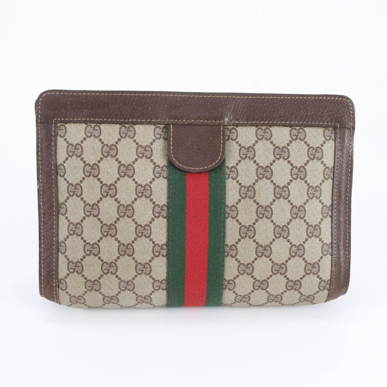 Gucci clutch bag supreme GG: Gucci clutch bag supreme GG Gucci's iconic Supreme GG clutch bag boasts a timeless brown hue, characteristic of the brand's signature style. Measuring 19cm x 28cm x 8cm, this versatile accessory featu