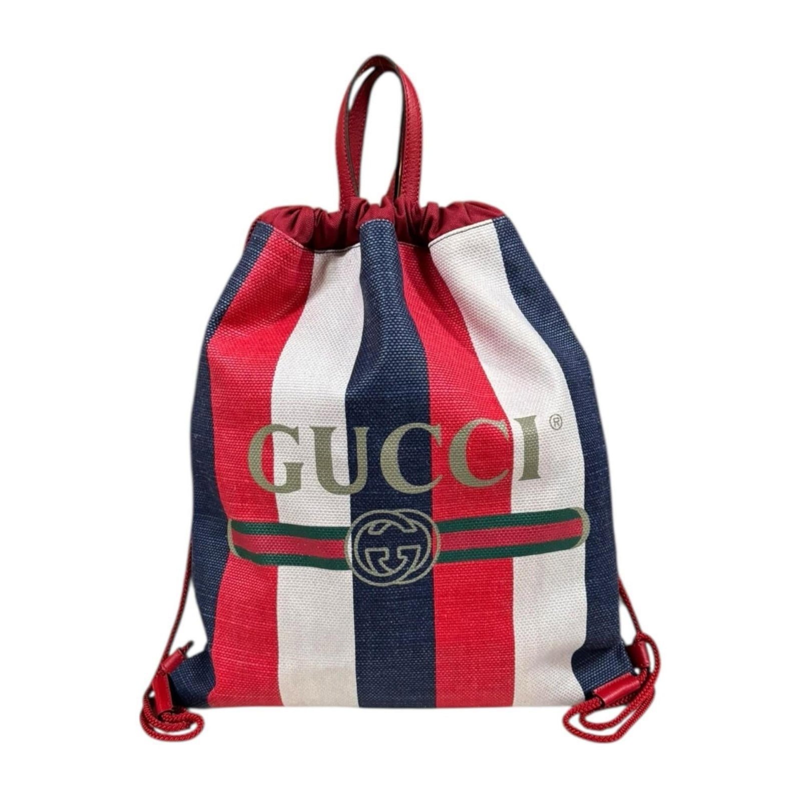 Backpack Leather Canvas Gucci: Backpack Leather Canvas Gucci Canvas and leather backpack with distinctive blue, red, and white color scheme. The backpack bears traces of usage, including scratches and dirt, but remains in good