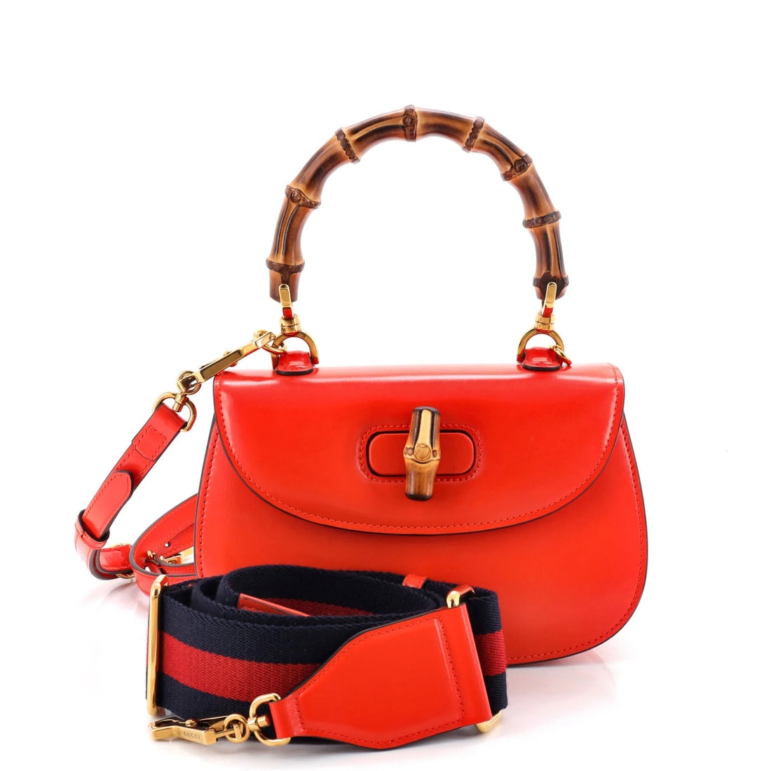 Bamboo leather small top handle bag Gucci 1947: Bamboo leather small top handle bag Gucci 1947 Small Orange Bamboo Leather Top Handle Bag from Gucci's 1947 Collection. This vibrant orange bag features a unique bamboo leather exterior and gold