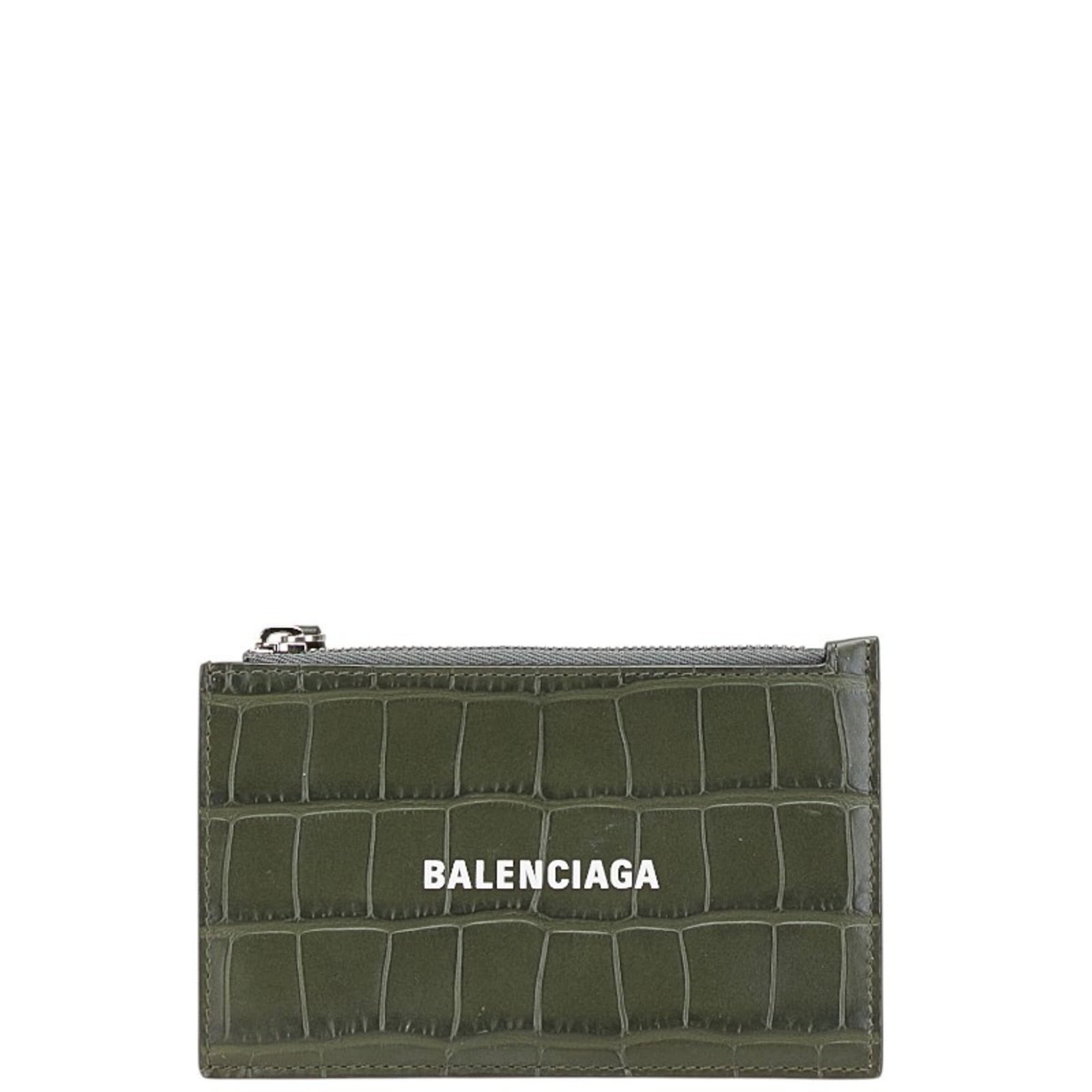 Card case in leather by Balenciaga: Card case in leather by Balenciaga Leather card case by Balenciaga, featuring khaki color and a worn-in look. The item shows some scratches and dirt, but remains in very good condition overall. A few