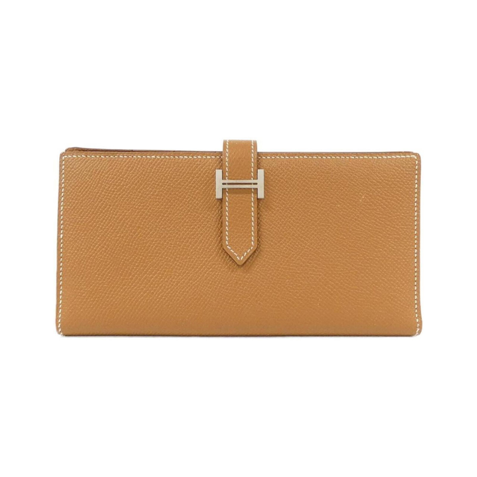 Epsom long bi-fold leather wallet from Hermes: Epsom long bi-fold leather wallet from Hermes Epsom long bi-fold leather wallet from Hermes, featuring high-quality Epsom leather in a rich brown color. This used bi-fold wallet showcases a few traces