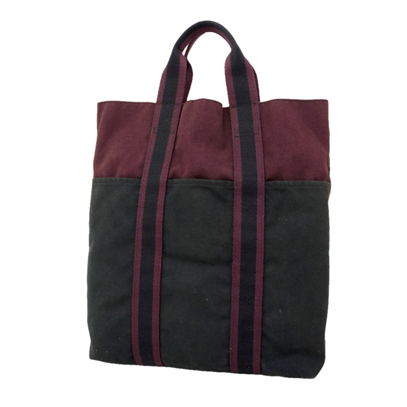 Canvas tote bag by Hermes: Canvas tote bag by Hermes Canvas tote bag by Hermes, featuring high-quality canvas material and a classic design. The black and brown color options add a touch of sophistication to this timeless piece