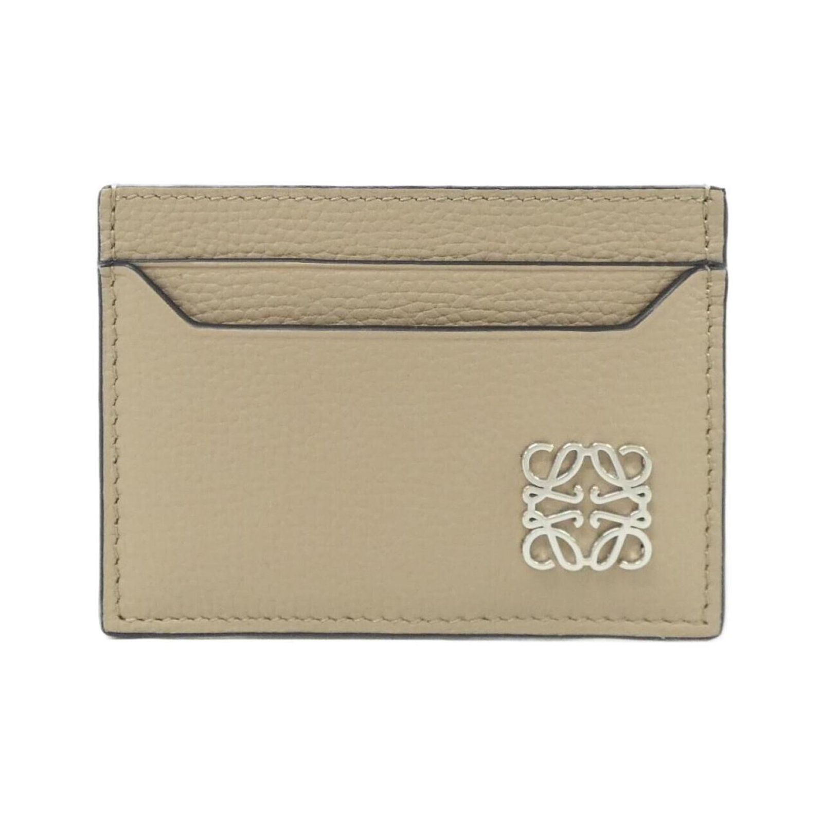 Card case leather: Card case leather This beige, sand-colored card case features high-quality calfskin leather with a few traces of usage and minor scratches. The used condition shows signs of wear but overall remains i