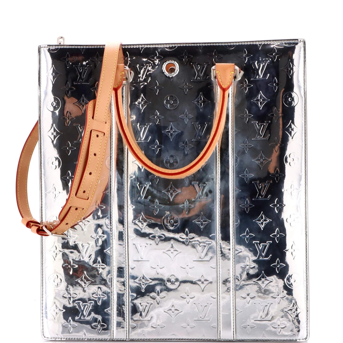 Sac Plat Bag Mirror Coated Canvas Monogram Louis Vuitton: Sac Plat Bag Mirror Coated Canvas Monogram Louis Vuitton Silver Sac Plat Bag with Monogram Mirror Coated Canvas Exterior, featuring scuffs and corner wear. This Louis Vuitton tote boasts a unique