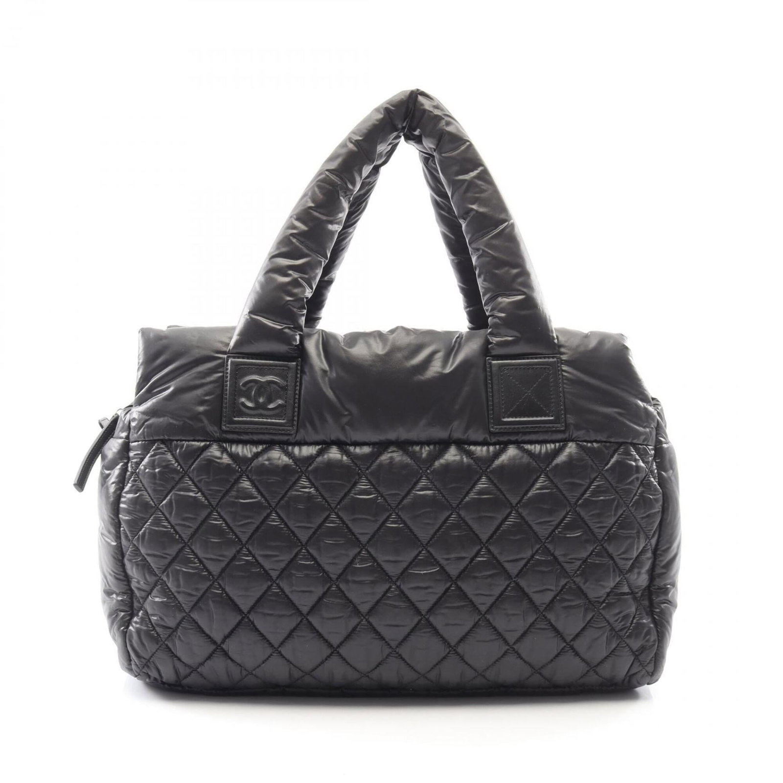 Handbag Nylon Leather by Chanel: Handbag Nylon Leather by Chanel Nylon and leather blend in sleek black, defining the iconic Chanel handbag style. Measuring 28cm x 39cm x 17cm, this versatile bag features a durable design with some m