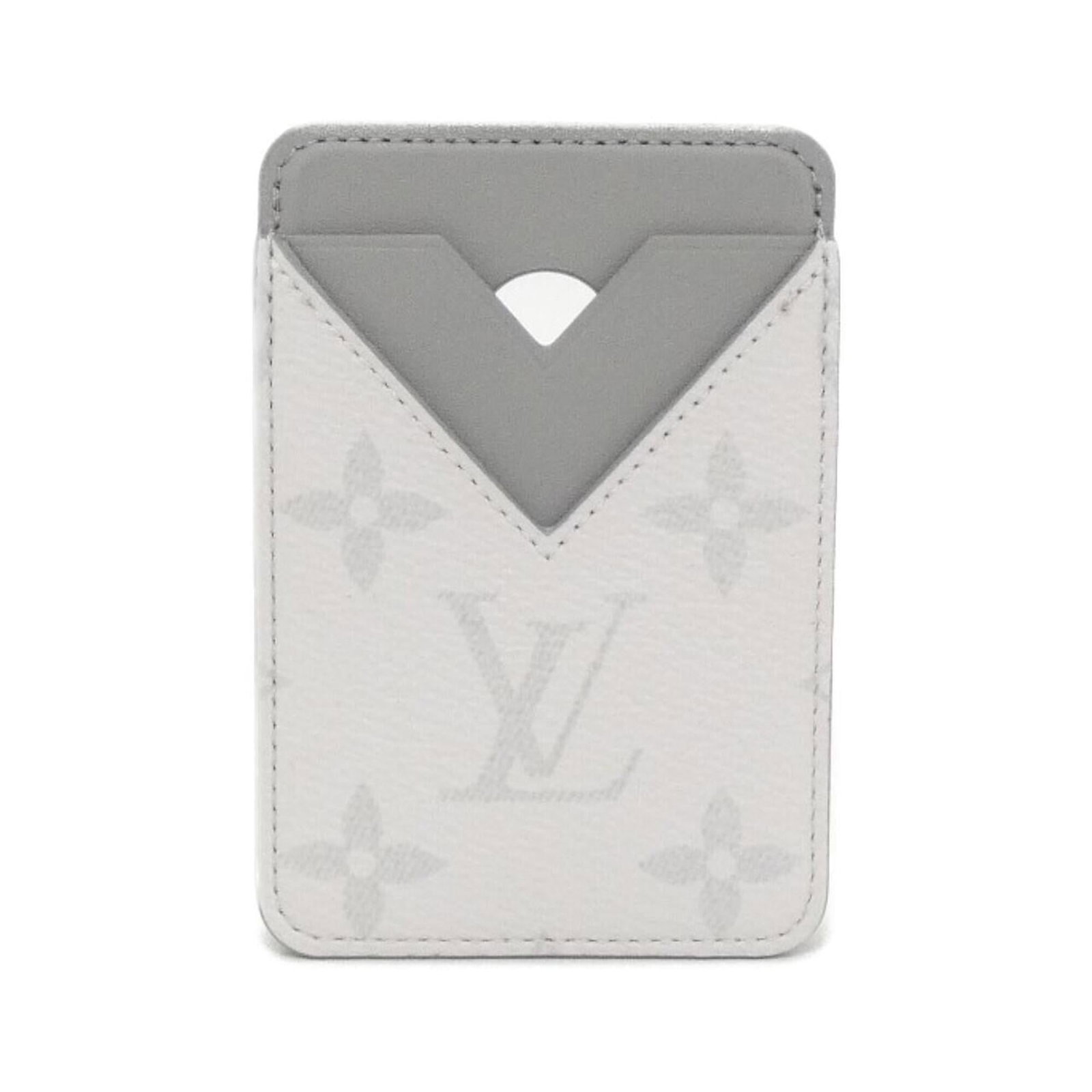 Business Card Case Louis Vuitton Taigarama: Business Card Case Louis Vuitton Taigarama The Louis Vuitton Taigarama business card case boasts a sleek, gris and white design. Made from the durable Taigarama material, it showcases a few subtle sig