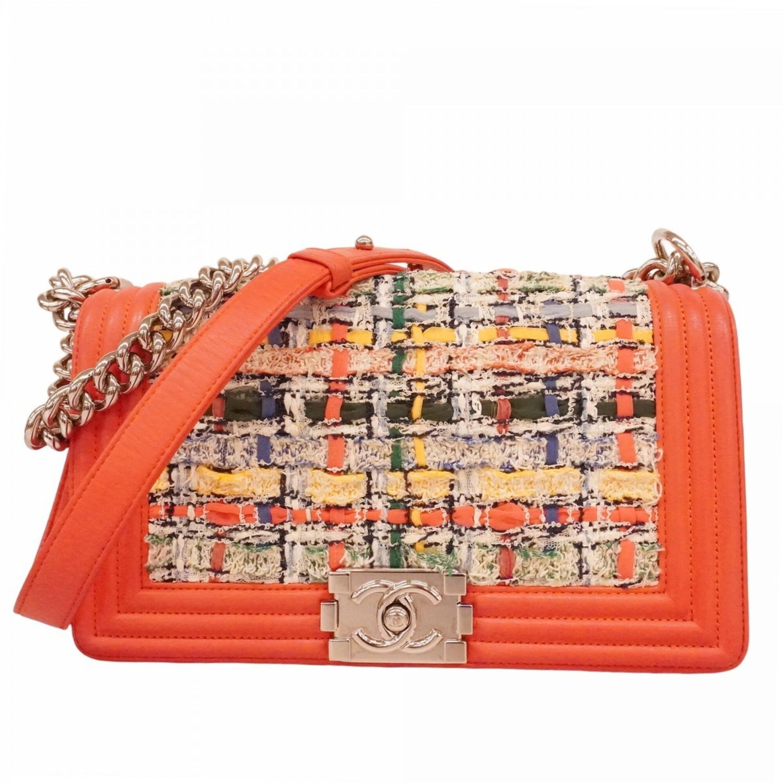 Shoulder Bag in Tweed by Chanel: Shoulder Bag in Tweed by Chanel Tweed shoulder bag from iconic fashion house Chanel, featuring a vibrant orange hue and sleek silver hardware. This pre-owned tote boasts a classic design with subtle