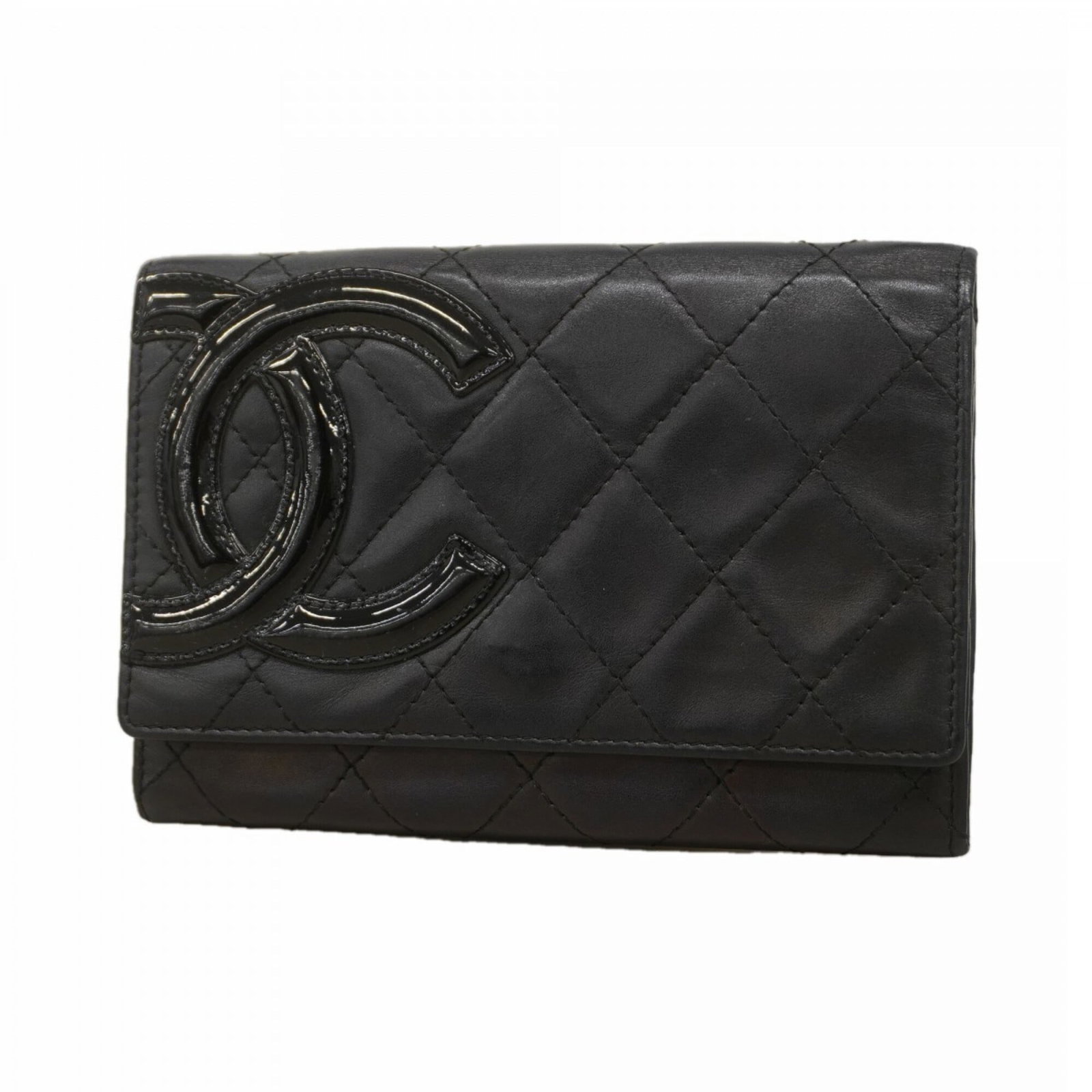 Leather Bi Fold Wallet By Chanel: Leather Bi Fold Wallet By Chanel This classic Chanel bi-fold wallet is crafted from high-quality lambskin leather, featuring a timeless black color. With its compact size and elegant design, it's