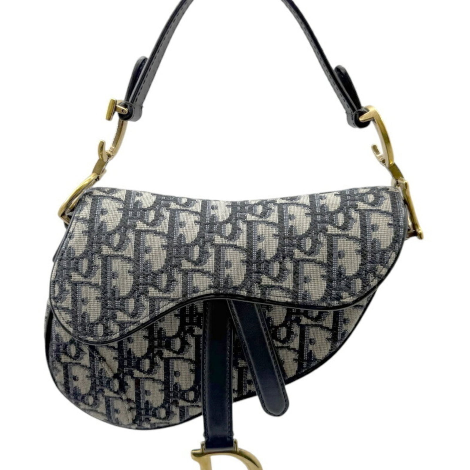Handbag Christian Dior Leather Saddle Canvas: Handbag Christian Dior Leather Saddle Canvas Navy canvas and leather saddle bag from Christian Dior, featuring a classic design with a few traces of usage visible. The bag has some scratches and dirt