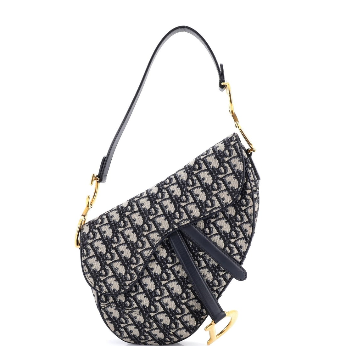 Canvas handbag saddle medium oblique Christian Dior: Canvas handbag saddle medium oblique Christian Dior Canvas handbag saddle medium oblique Christian Dior features a blue canvas exterior with minor scuffs and creases, giving it a worn-in look. The