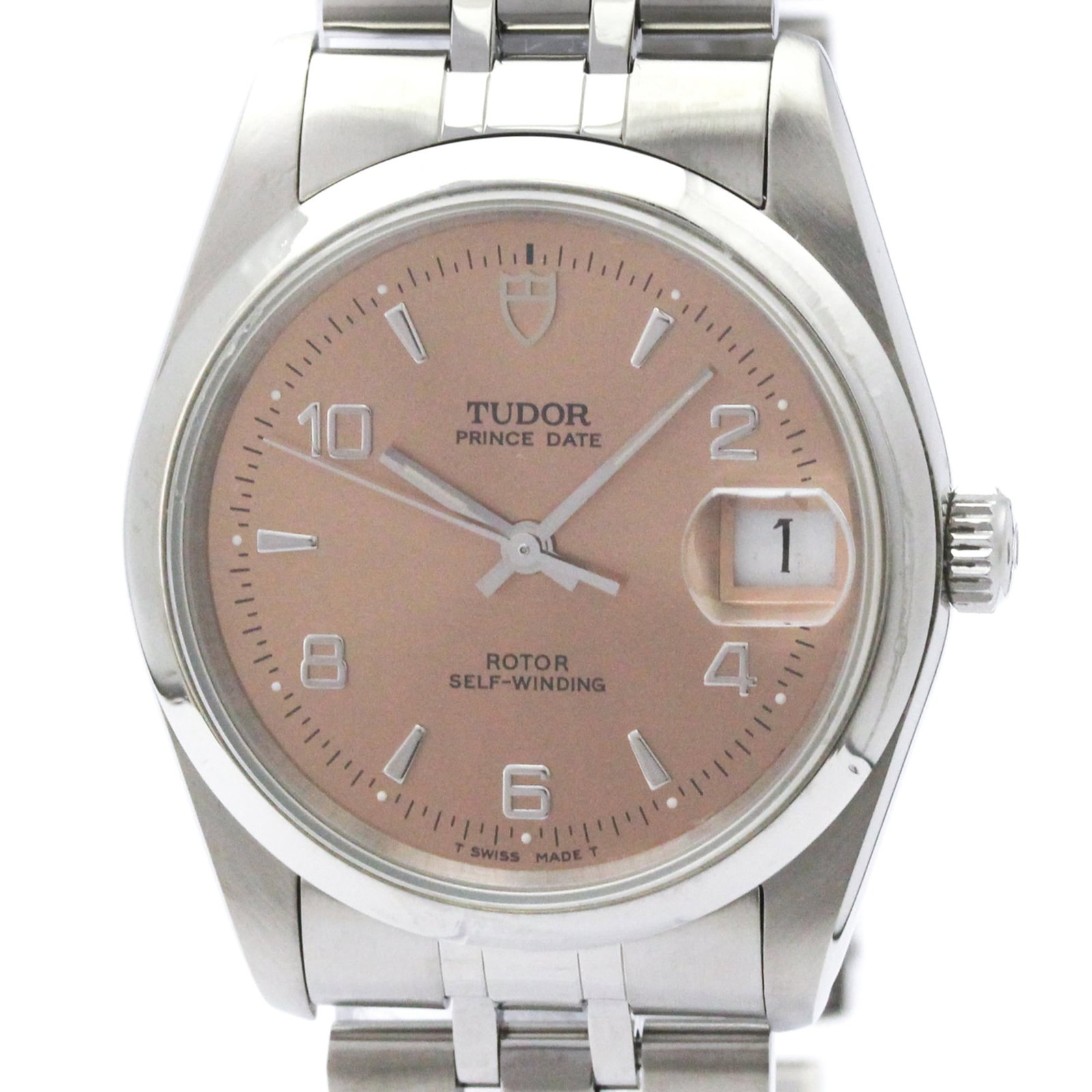 Tudor Wristwatch: Tudor Wristwatch Stainless steel case and band, the Tudor wristwatch boasts a sporty design with a 34mm diameter. The pink dial adds a touch of elegance to this versatile timepiece, which has been wel