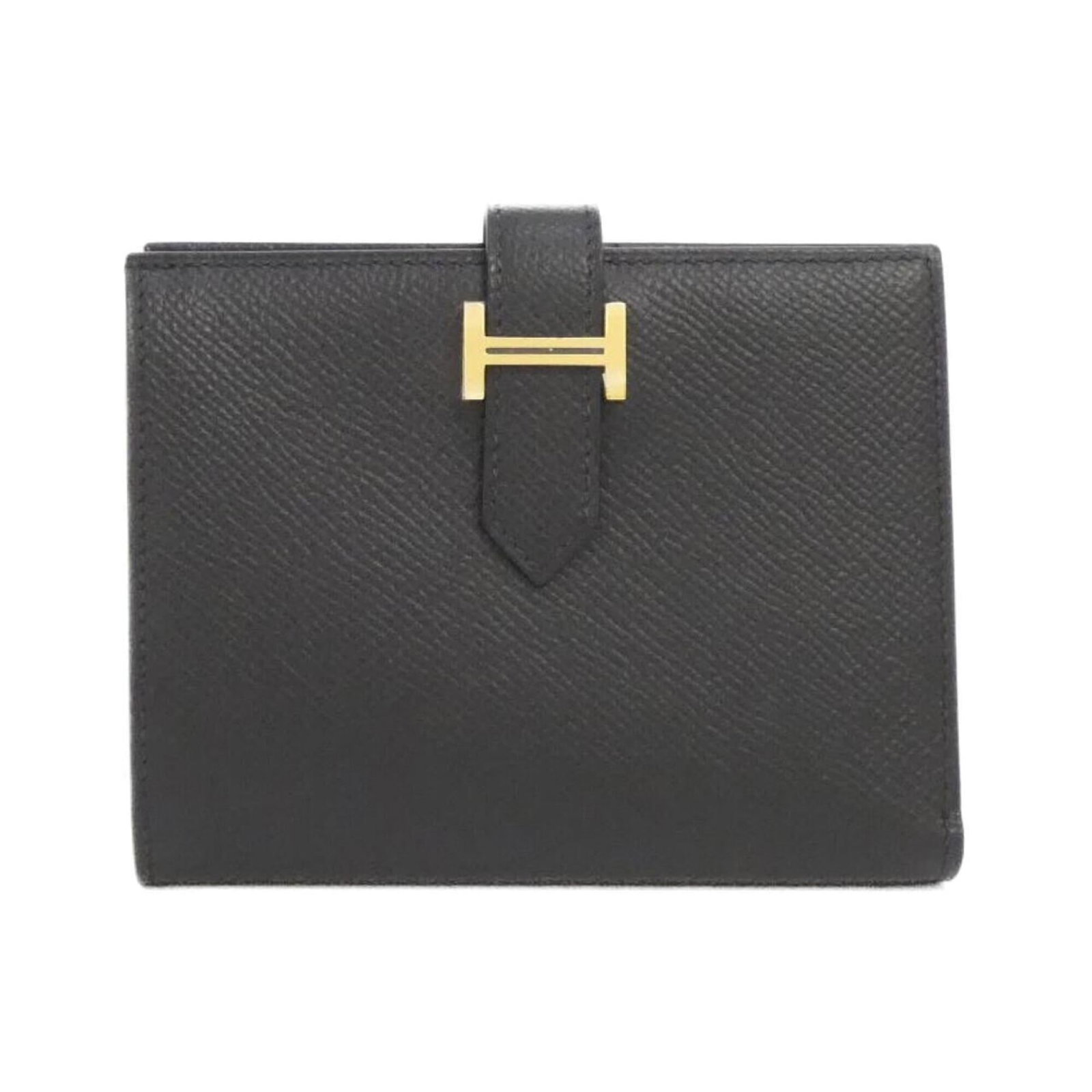 Hermes Wallet (Bi-Fold) Epsom Leather: Hermes Wallet (Bi-Fold) Epsom Leather Epsom leather provides a rich, luxurious feel to this black bi-fold wallet from Hermes. With its classic design and subtle scratches from previous use, this walle