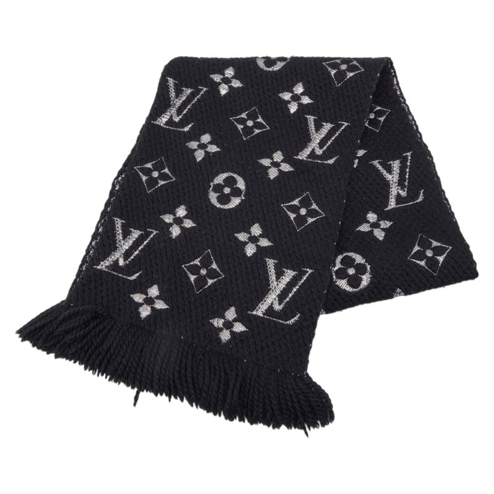 Silk wool stole from Louis Vuitton: Silk wool stole from Louis Vuitton Silk wool stole from Louis Vuitton, measuring 1.65m x 28cm in dimensions, boasts a luxurious blend of materials and a sleek black color. With traces of usage