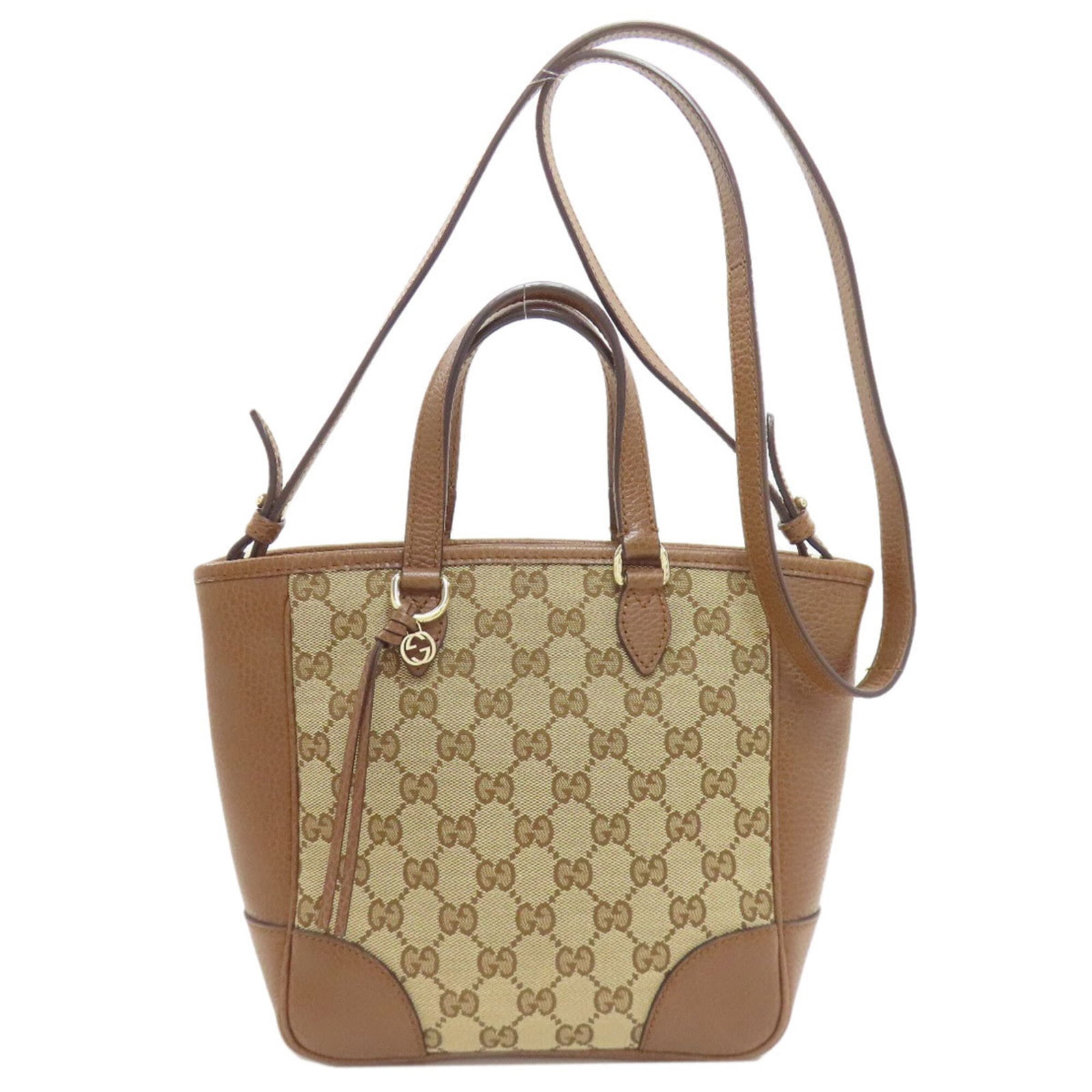 Canvas leather handbag: Canvas leather handbag Canvas leather handbag in brown, featuring an open closure and measuring 20cm x 28cm x 10.5cm. The bag shows some signs of usage, with a few scratches and dirt visible, but rema