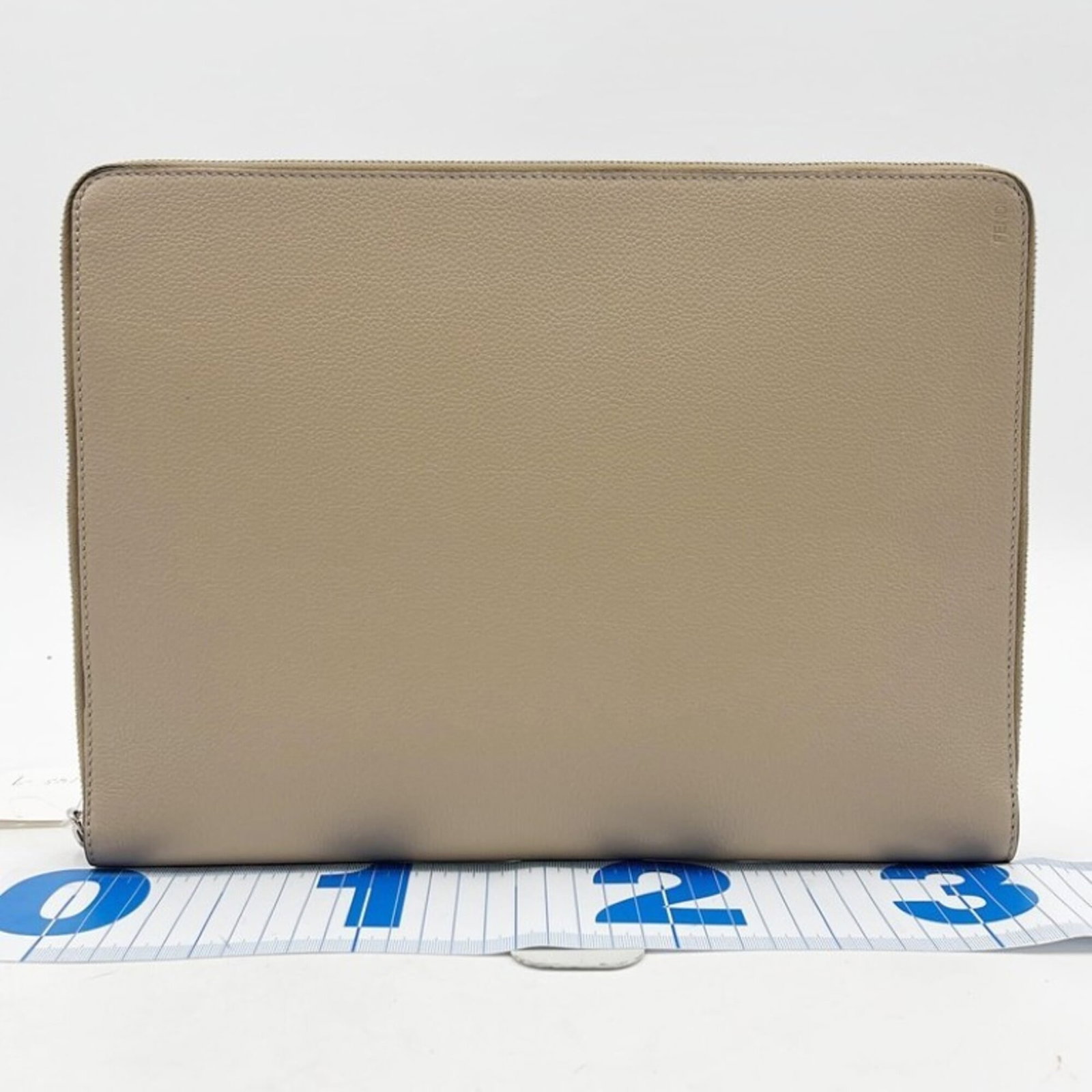Fendi Clutch Bag Leather: Fendi Clutch Bag Leather Fendi Clutch Bag Leather - A luxurious beige leather clutch bag with clean lines and classic design, measuring 25cm x 34cm x 3cm. Opened but never used, this high-quality