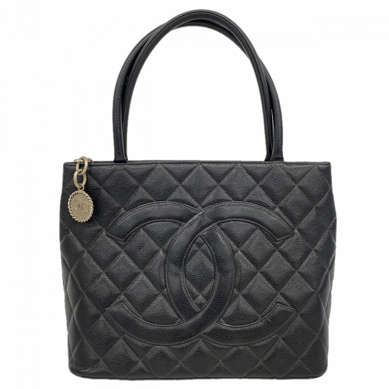 Calfskin Bag Tote Chanel: Calfskin Bag Tote Chanel Calfskin Bag Tote Chanel - A Timeless Black Classic. This black grained calfskin tote bag from Chanel features silver hardware and a classic design that exudes sophistication.