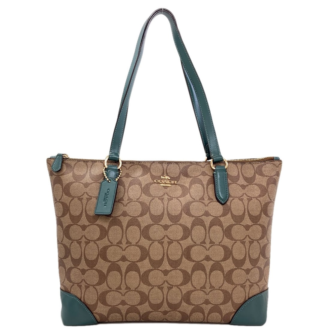 Signature Pvc Leather Coach F29208 Tote Bag: Signature Pvc Leather Coach F29208 Tote Bag Brown PVC leather COACH F29208 tote bag with signature. This stylish tote features a brown exterior made from high-quality PVC material, bearing the iconic