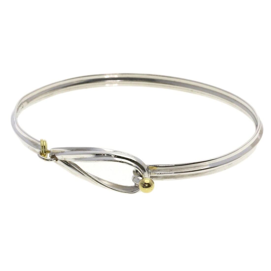 Tiffany Co Hook Eye Silver 18k Yellow Gold: Tiffany Co Hook Eye Silver 18k Yellow Gold Tiffany & Co's Hook Eye Silver 18k Yellow Gold bracelet showcases elegant simplicity with its sleek design and silver finish. The absence of a main stone all