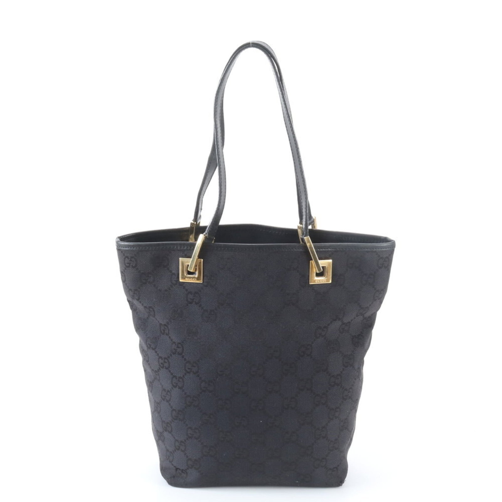 Canvas leather tote bag by Gucci: Canvas leather tote bag by Gucci Canvas leather tote bag by Gucci, featuring a classic design with a canvas and leather construction. This versatile bag measures 24cm x 17cm x 9cm and has a sturdy