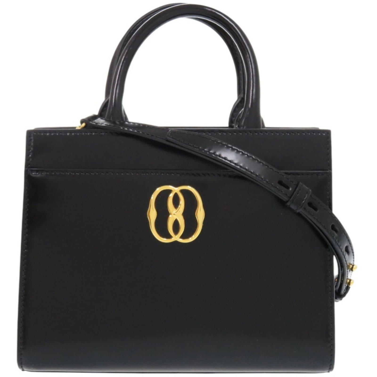 Patent Leather Canvas Tote Bag: Patent Leather Canvas Tote Bag Patent leather canvas tote bag in black, featuring a unique combination of materials and design. Made from patent leather and canvas, this bag boasts a sleek and