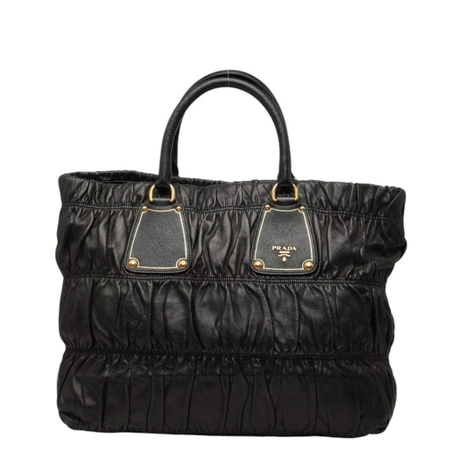 Tote Bag Leather by Prada: Tote Bag Leather by Prada Saffiano leather tote bag from Prada, featuring a classic design with a timeless black color. The bag has been used and shows traces of usage, including scratches and dirt, b