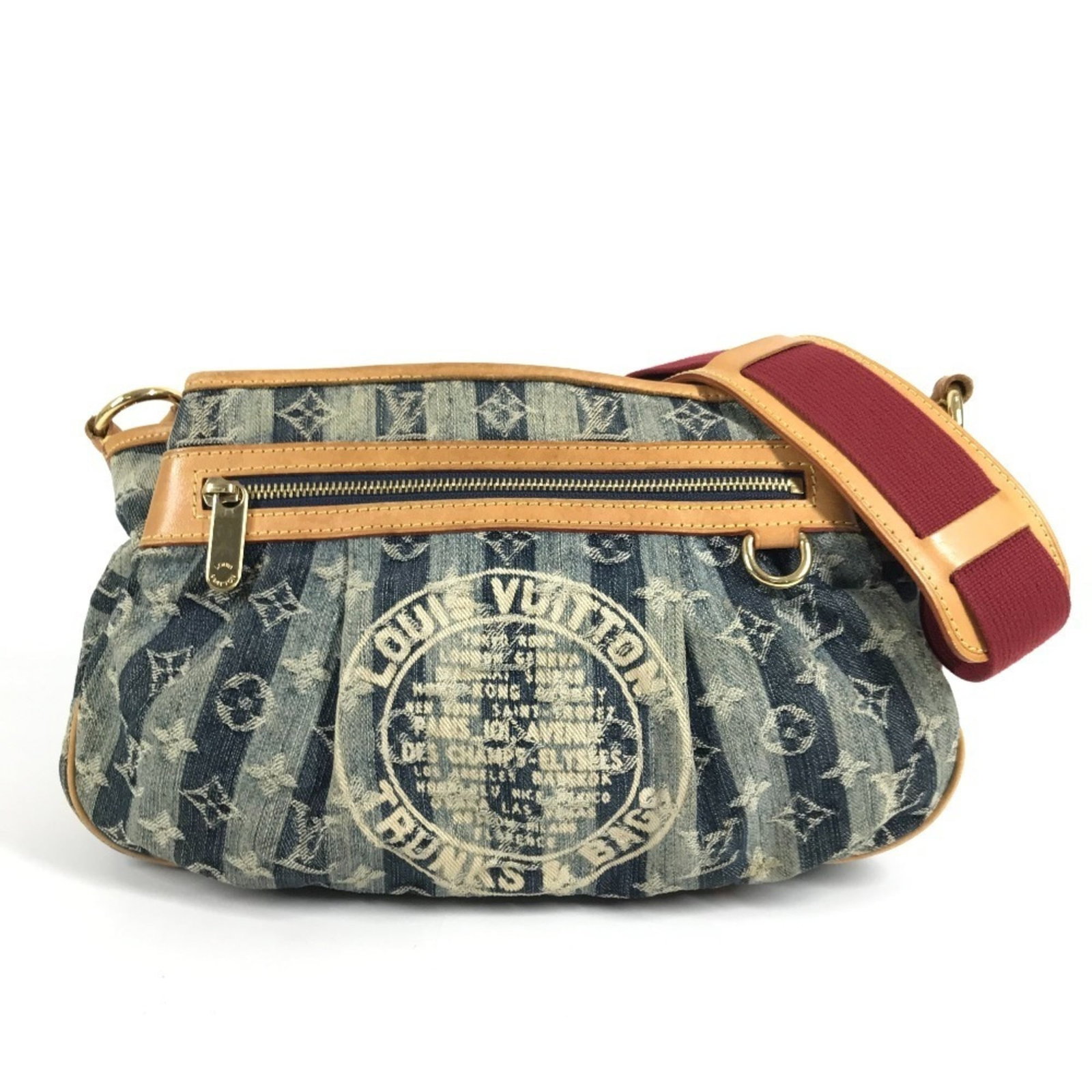 Monogram Denim Bag from Louis Vuitton: Monogram Denim Bag from Louis Vuitton Monogram Denim Bag from Louis Vuitton boasts its iconic blue monogram pattern, a timeless design element that adds a touch of sophistication to any outfit. Measur