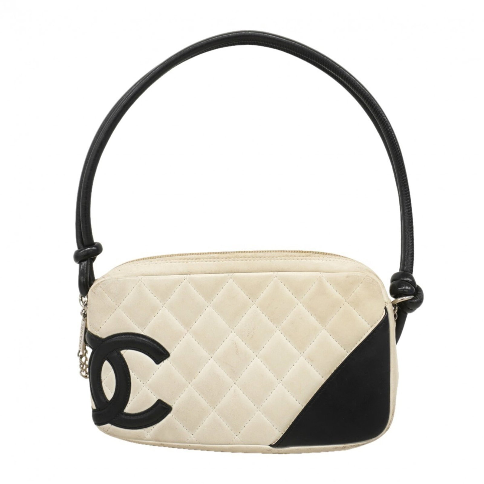 Chanel Handbag Leather: Chanel Handbag Leather Black and White Lambskin Chanel Handbag. This used handbag features silver hardware and has a classic design, with traces of usage visible on the exterior. The lambskin leather