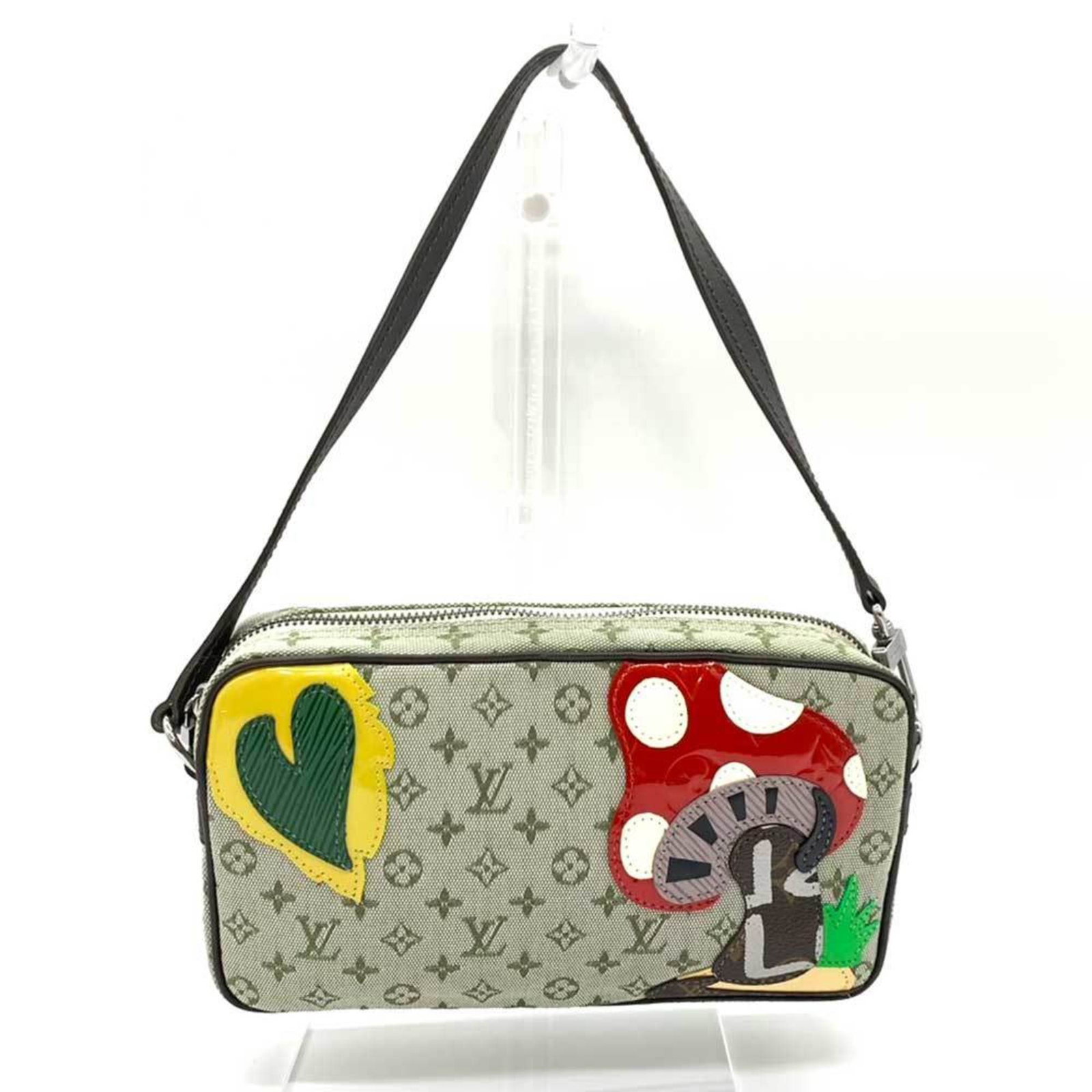 Handbag Pochette Louis Vuitton Monogram Mini: Handbag Pochette Louis Vuitton Monogram Mini The Louis Vuitton Monogram Mini Pochette features the iconic monogram pattern in a unique green, khaki, and multi-color design. This compact handbag