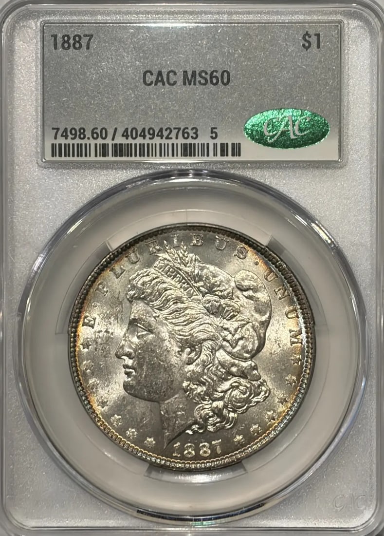 MORGAN DOLLAR CACG MS60 RAINBOW TONING 1887: MORGAN DOLLAR CACG MS60 RAINBOW TONING 1887 MS60 Rainbow Toning 1887 Morgan Dollar CAC Gently showcasing its unique silver tone, this 1887 Morgan Dollar boasts a striking rainbow effect on its