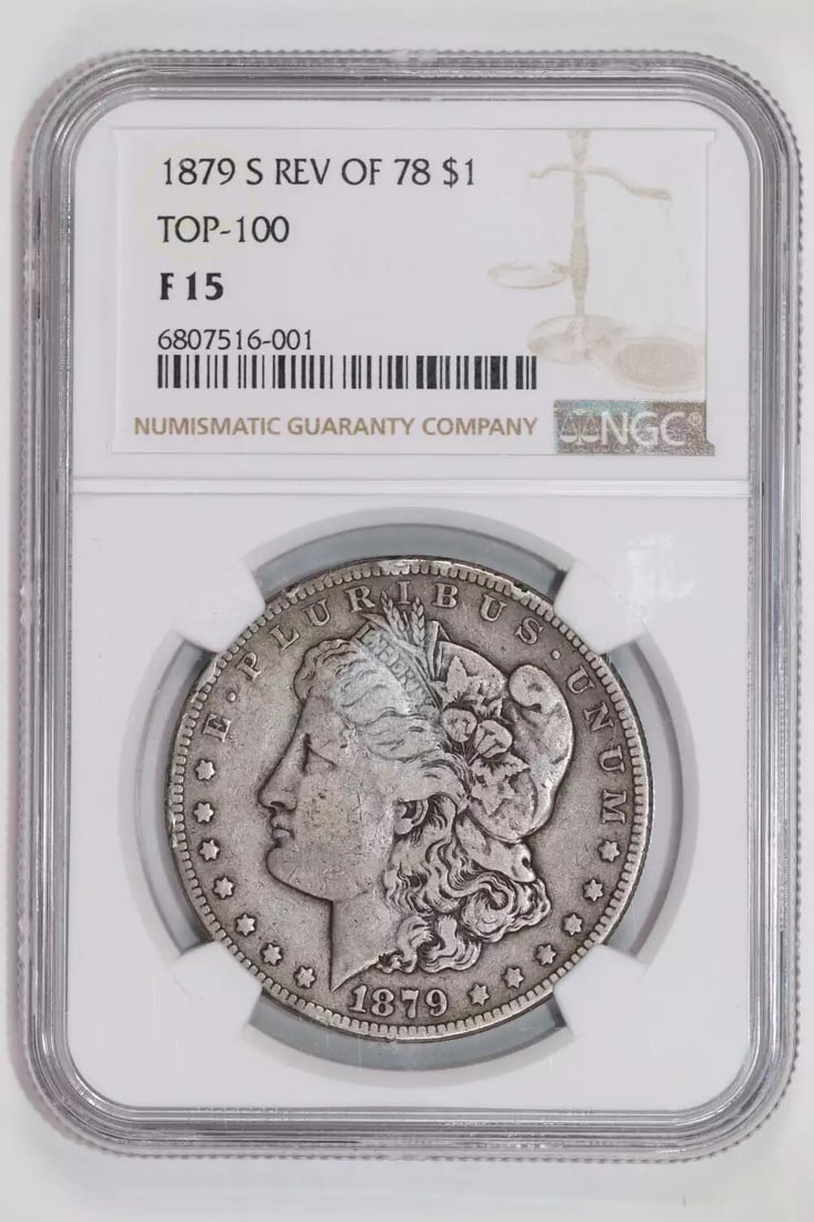REVERSE 1879-S 1878 MORGAN NGC F15: REVERSE 1879-S 1878 MORGAN NGC F15 The Reverse 1879-S Morgan dollar, certified by NGC as F15, showcases the San Francisco mint's distinctive reverse design. This circulated coin bears the signature of