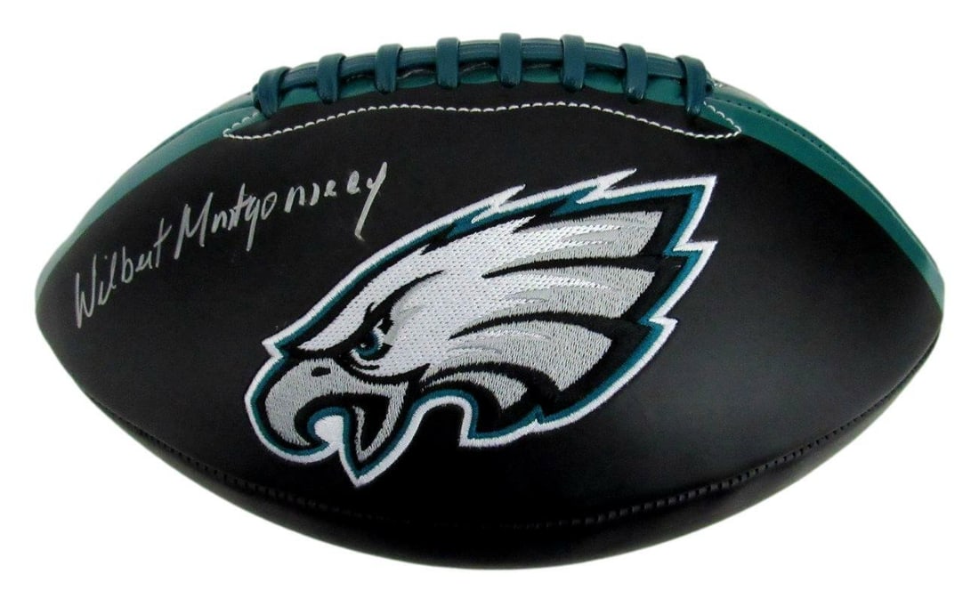 Montgomery signed black football logo eagles autographed by Wilbert: Montgomery signed black football logo eagles autographed by Wilbert Signed by Wilbert Montgomery, the legendary Eagles running back, this black football logo features his signature in bold strokes. Th