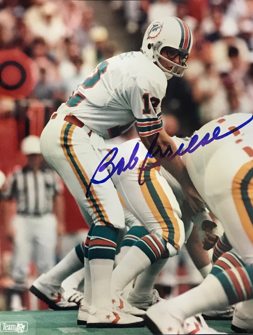 Autographed Football Photo By Bob Griese: Autographed Football Photo By Bob Griese Bob Griese's sharpie signature adds a personal touch to this 8x10 football photo, capturing the legendary quarterback's iconic presence. The photo itself is a
