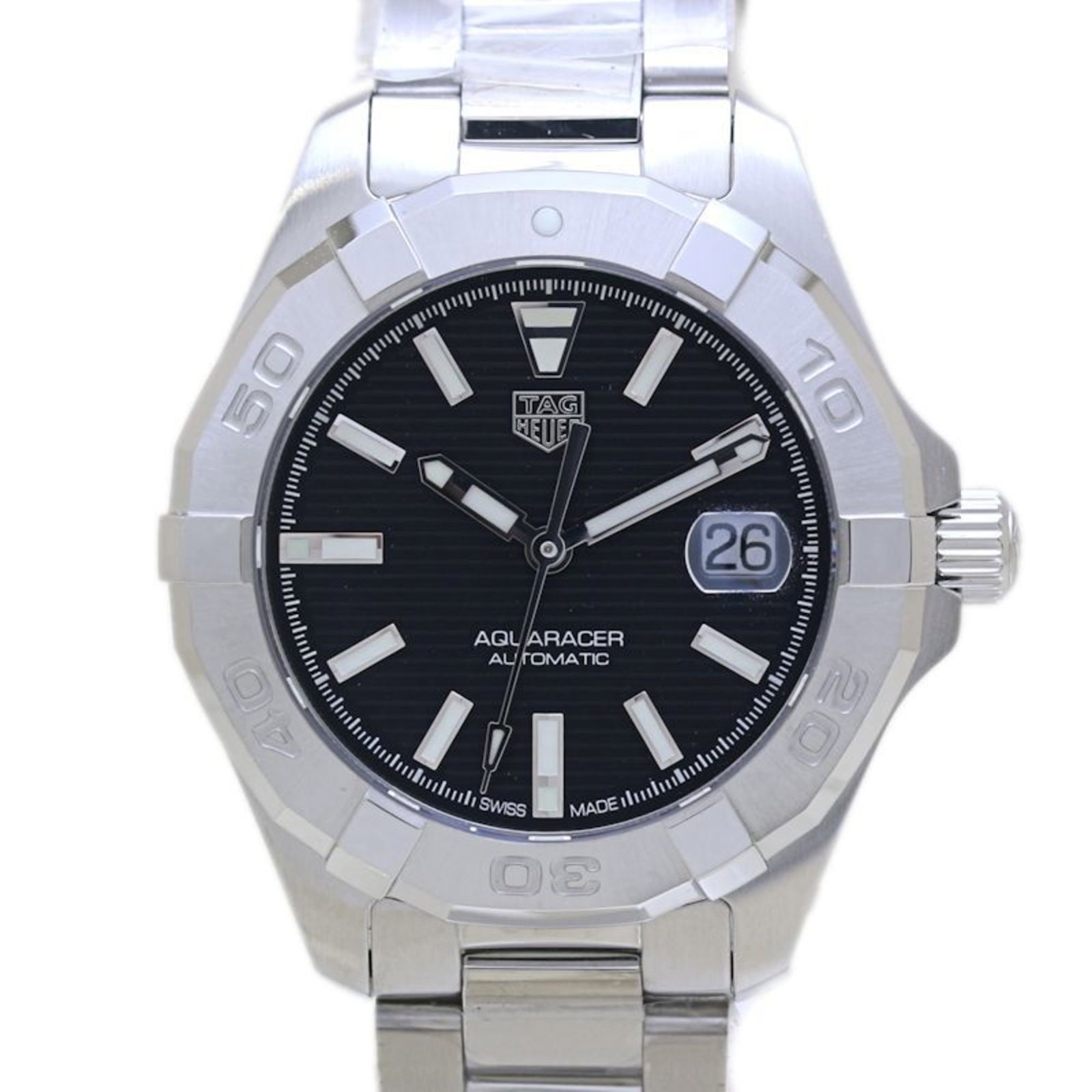 Tag Heuer Wristwatch: Tag Heuer Wristwatch Stainless steel case and band provide a sleek, modern look. The black dial features an analog display, making it easy to tell time. This Tag Heuer wristwatch has a classic design