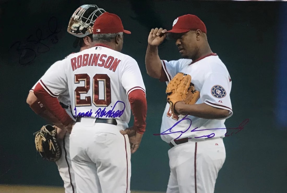 Brian Schneider Frank Robinson Livan Hernandez autographed photo: Brian Schneider Frank Robinson Livan Hernandez autographed photo Item Specifics: Signed in blue sharpie across the front of the photo Autograph is authenticated by , and will be accompanied by a COA