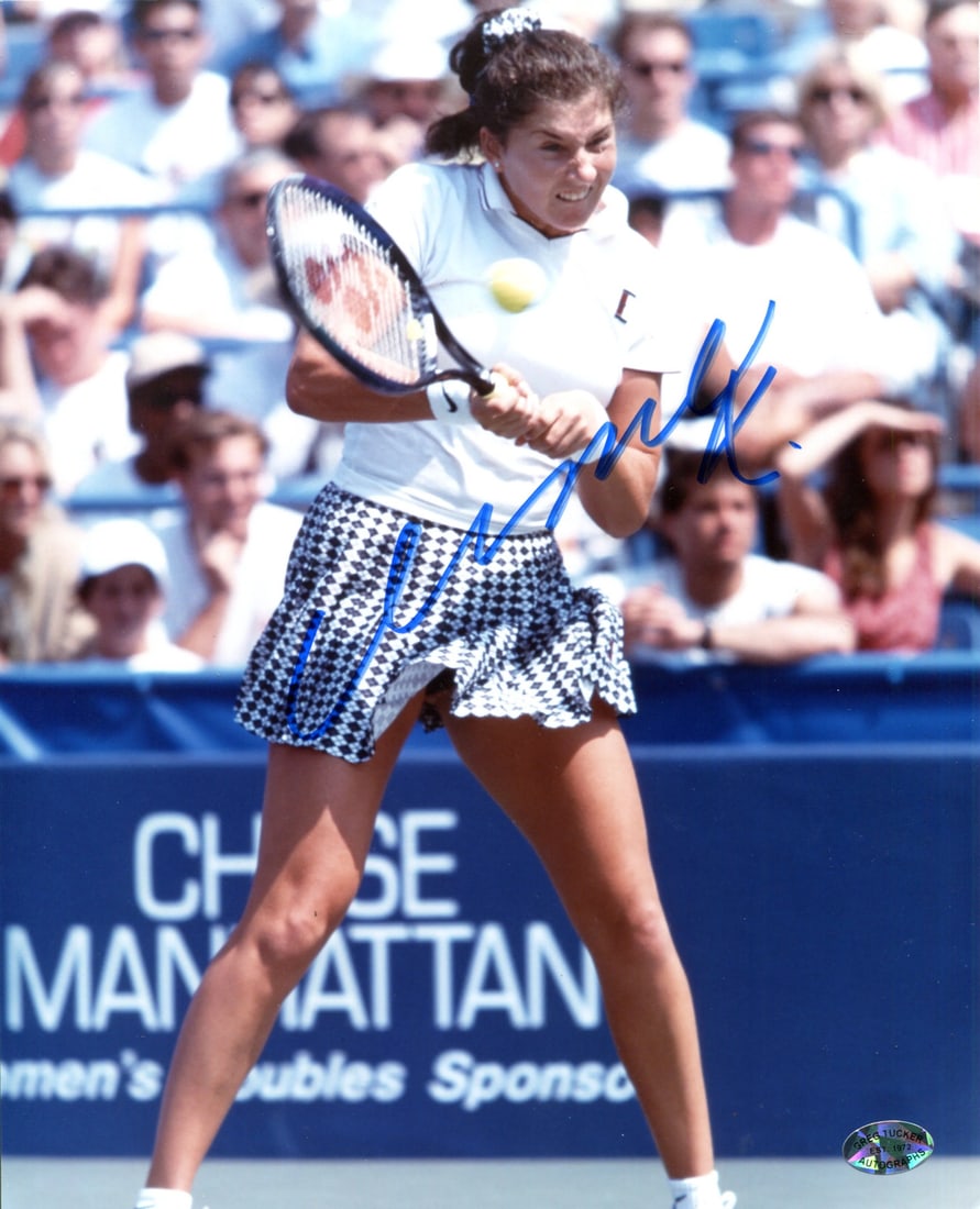 Tennis Photo Autographed By Monica Seles: Tennis Photo Autographed By Monica Seles Monica Seles' signature shines across the front of this 8x10 tennis photo, bearing her mark in blue sharpie. The image captures a moment in time from the