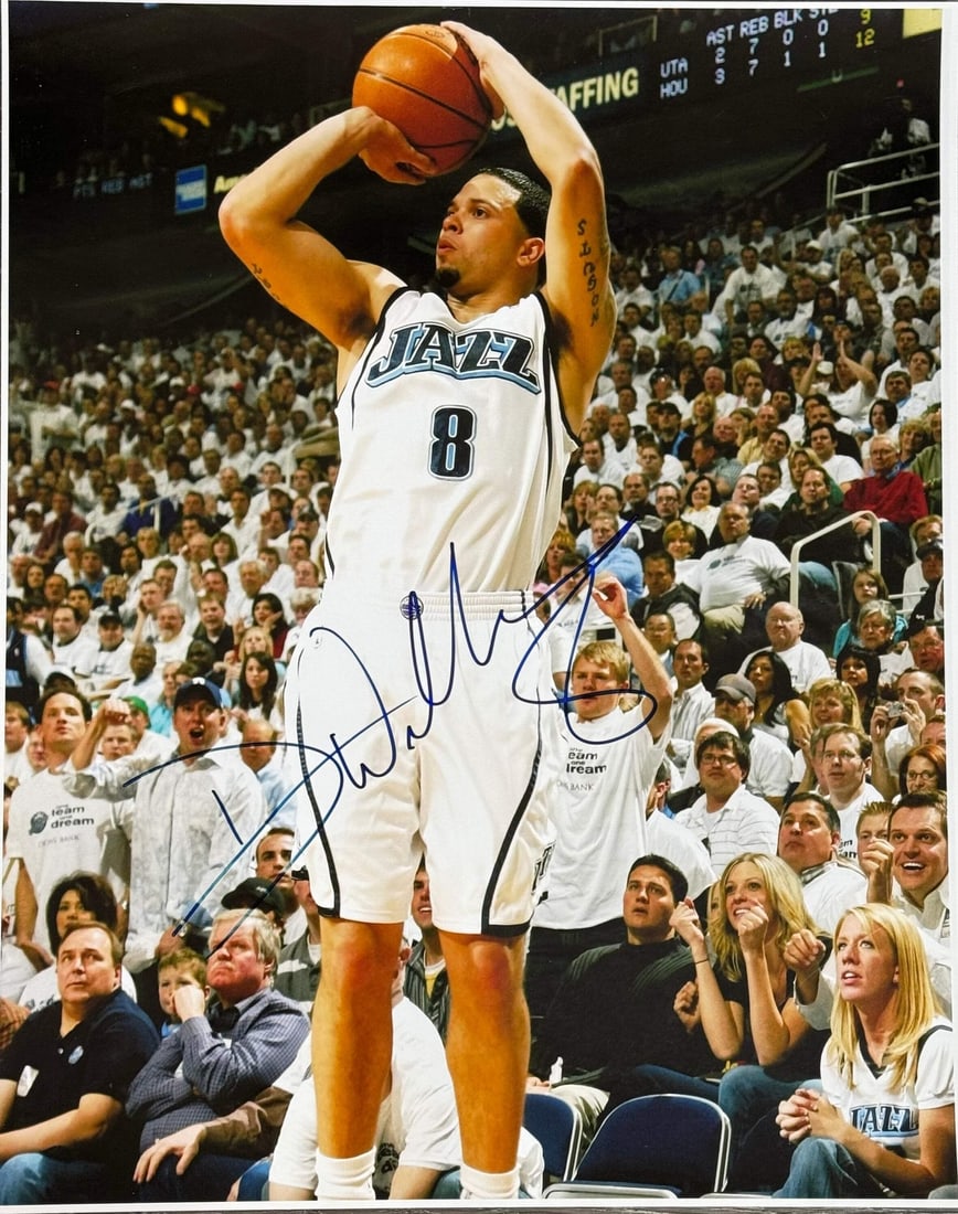 Williams Deron Autographed Basketball Photo: Williams Deron Autographed Basketball Photo The Deron Williams Autographed Basketball Photo is a unique piece featuring the Utah Jazz legend's signature in blue sharpie across the front of a 16x20